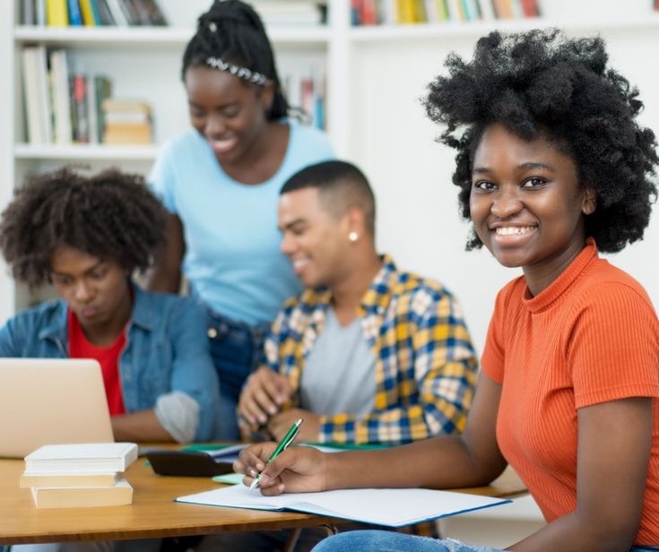 Students in the registrar office preparing for enrollment.